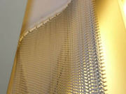 Wire mesh coil drapery gives home and halls magnificent effect